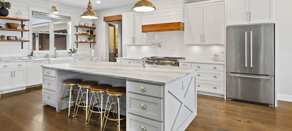 A large kitchen with gold stools