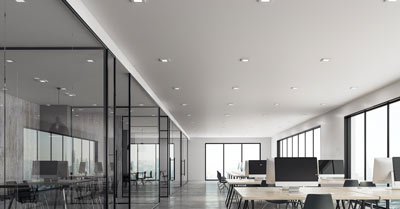 A clean office with a large plastered ceiling