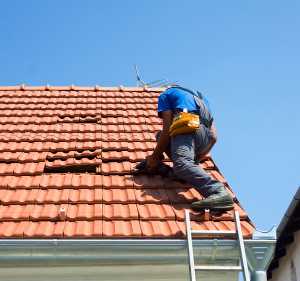 A man repairing a roof