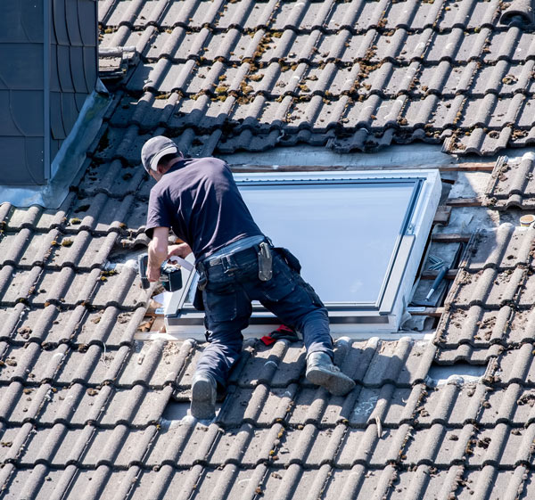 A man repairing a roof